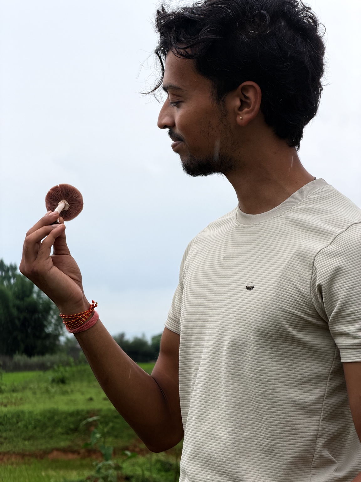 Tanishk holding a mushroom